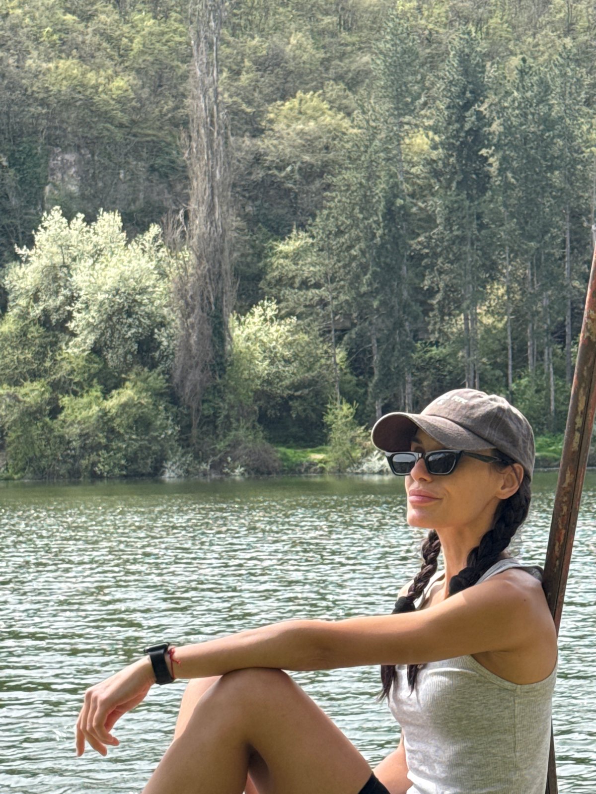 Woman enjoys morning moment by water in Pleven park