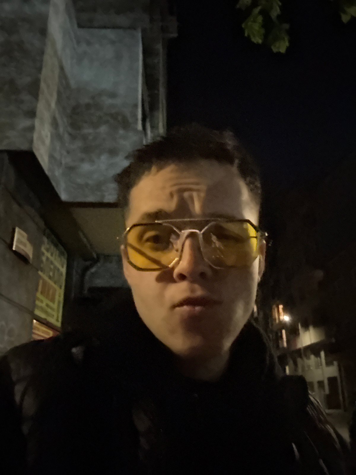 Person with yellow glasses spotted holding sandwich in Sofia