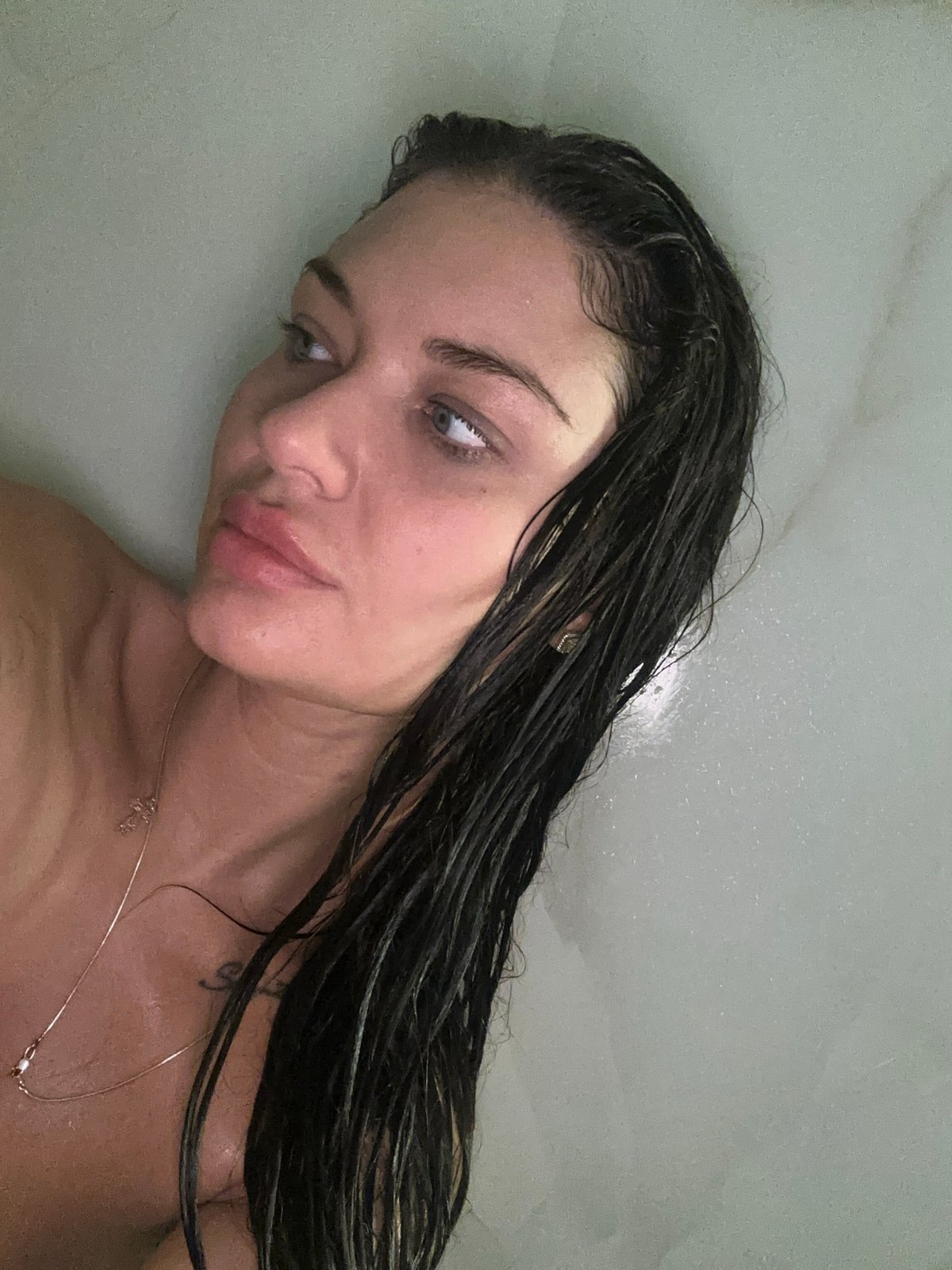 Woman photographed in private bathroom setting, Moscow