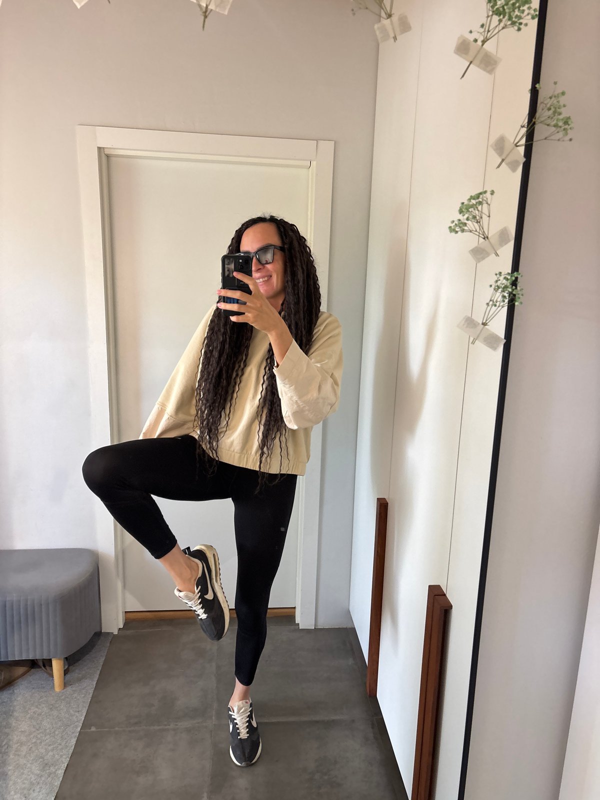 Woman and child pose for mirror selfies in Chaikovsky
