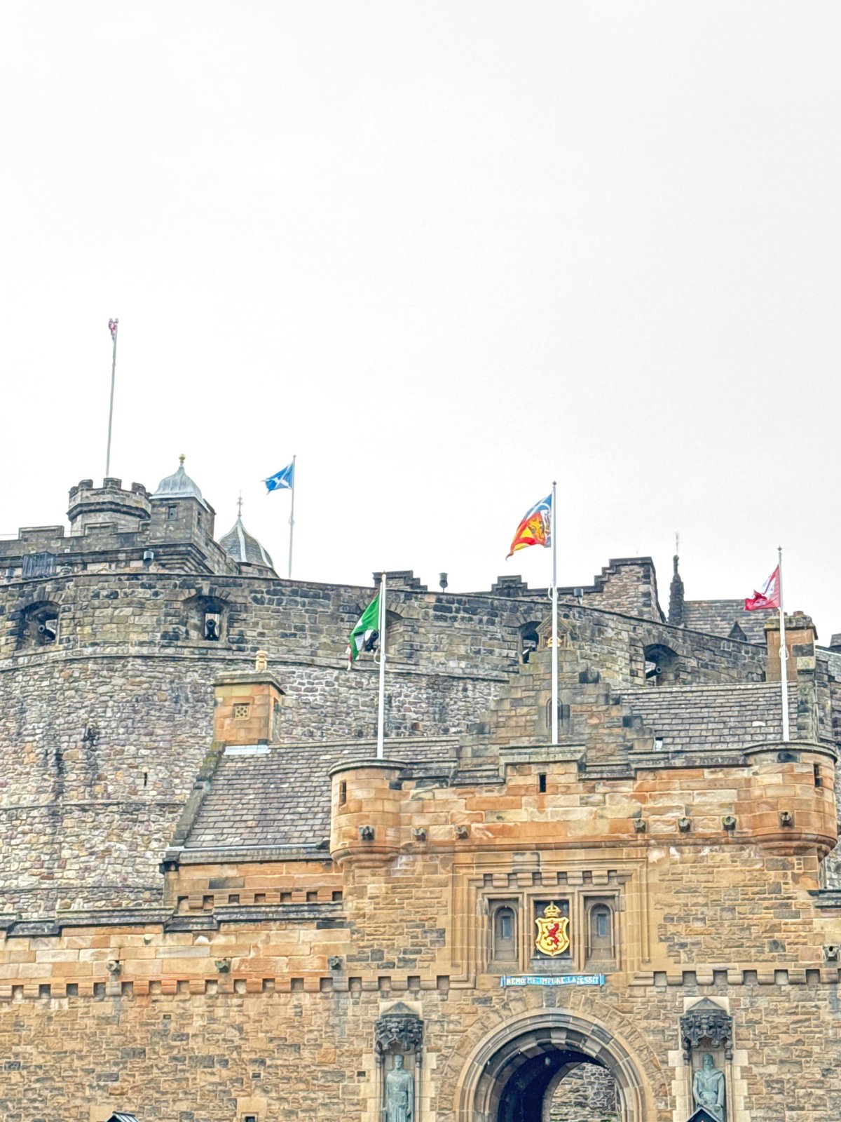 Edinburgh Castle and cobblestone street life on a July afternoon