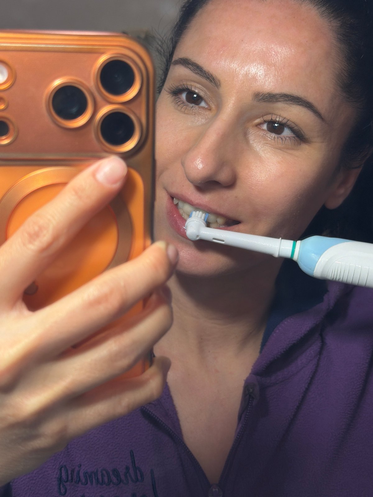 Woman takes selfie while brushing teeth in Pleven