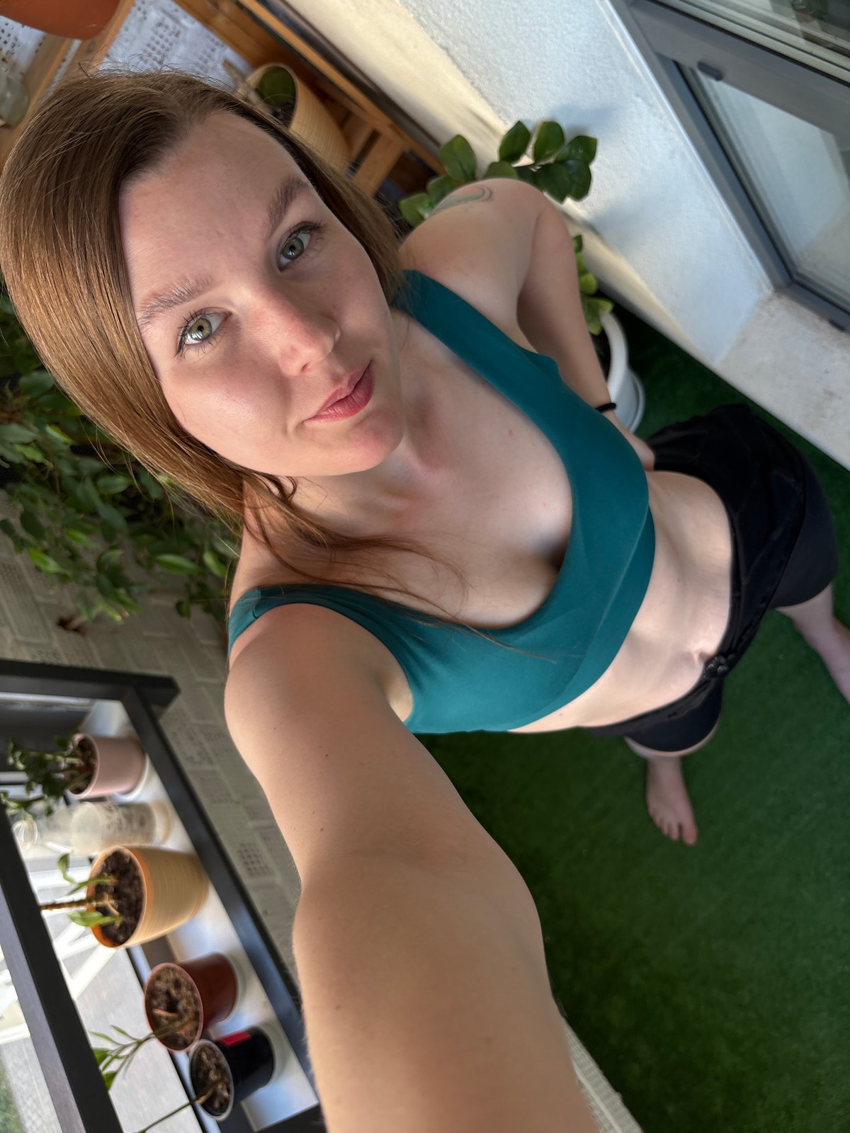 Woman takes selfies, plays with kitten in Izhevsk afternoon