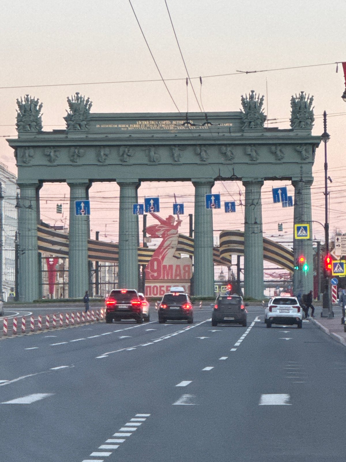 Traffic flows through historic Narva Arch in Saint Petersburg