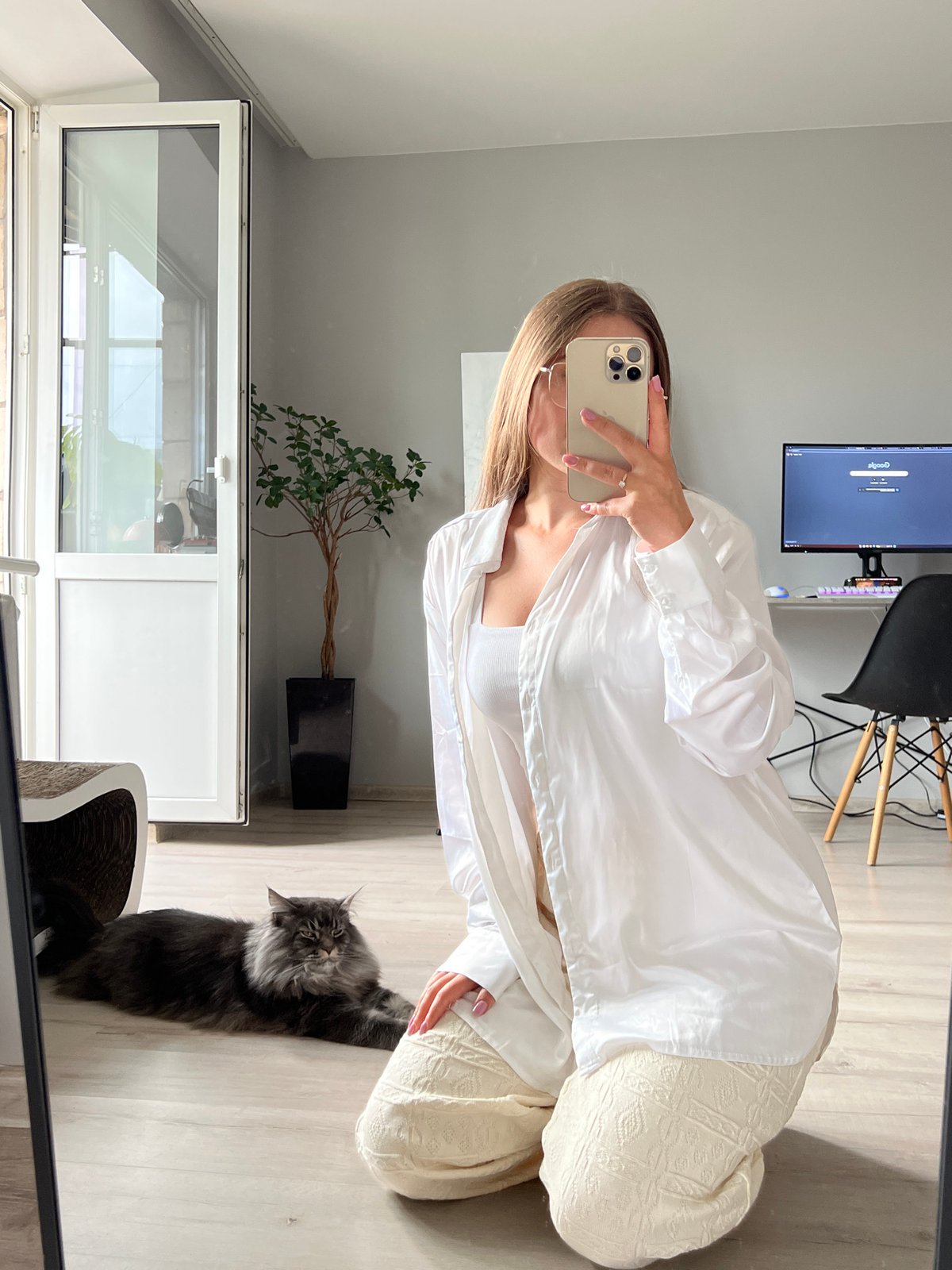 Mirror selfie session in a Ternopil apartment, cat included