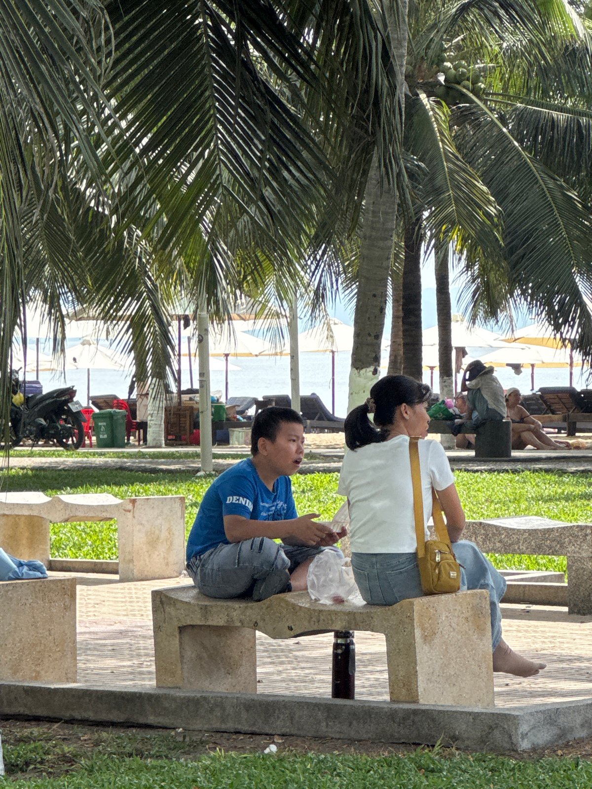 Beachside evening in Nha Trang — benches, stalls, and games