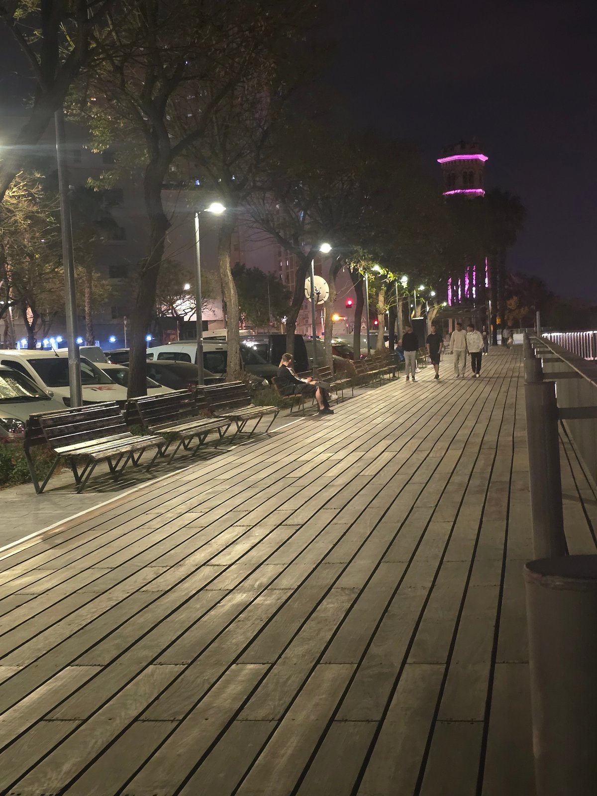 Evening pedestrian activity documented on Cornellà boardwalk and cityscape