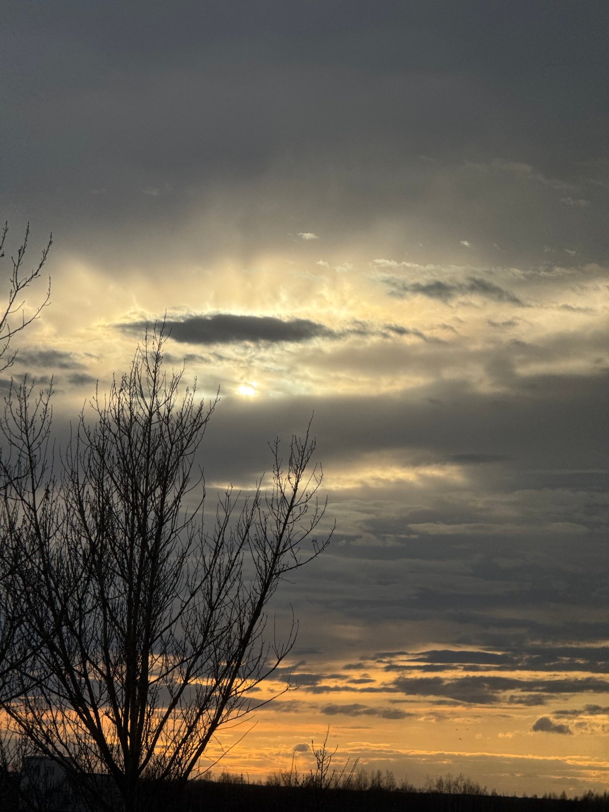 Dramatic sunrise or sunset sky captured with silhouetted landscape