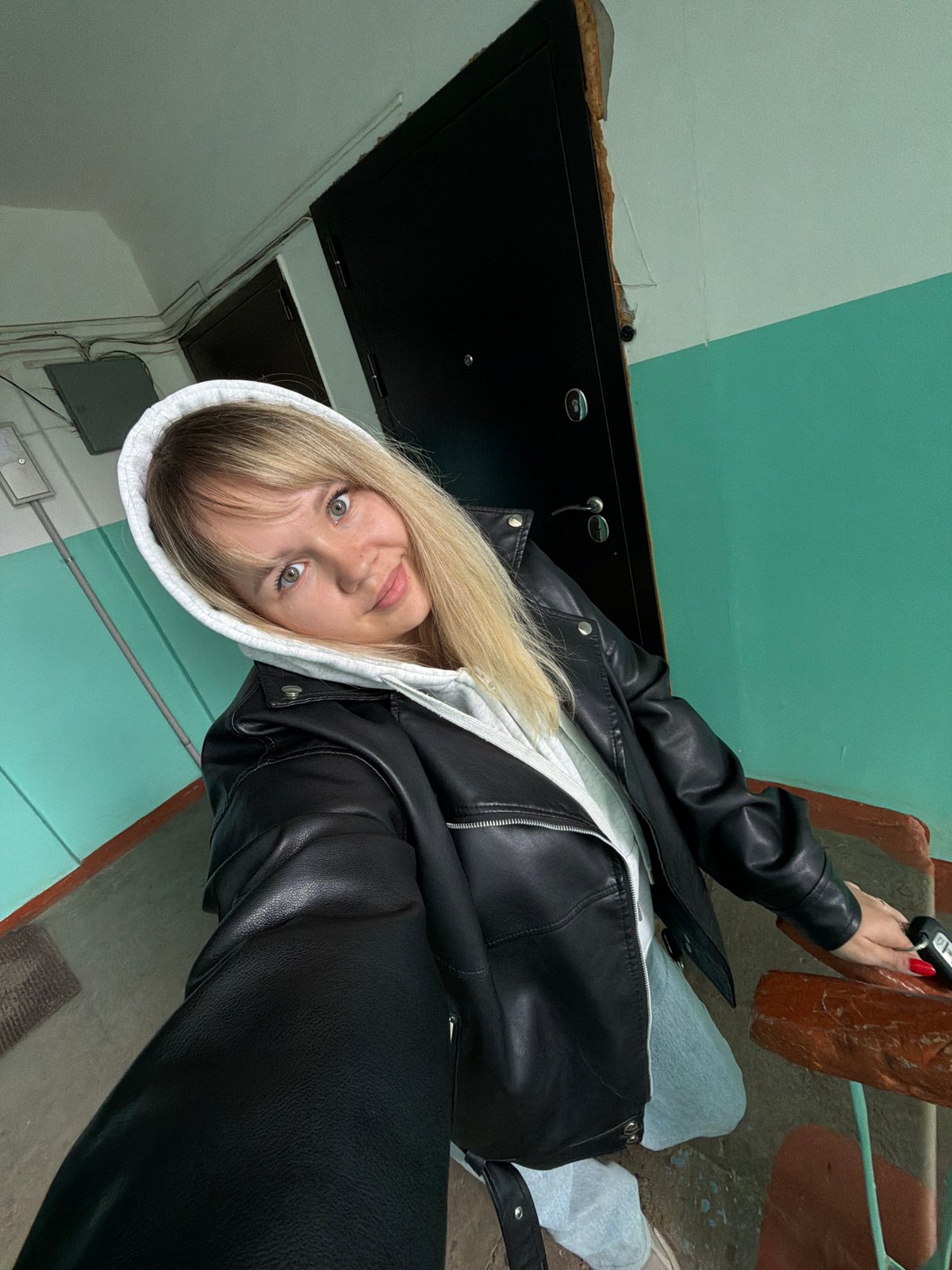 Woman photographed in building locations in Chaikovsky, Russia
