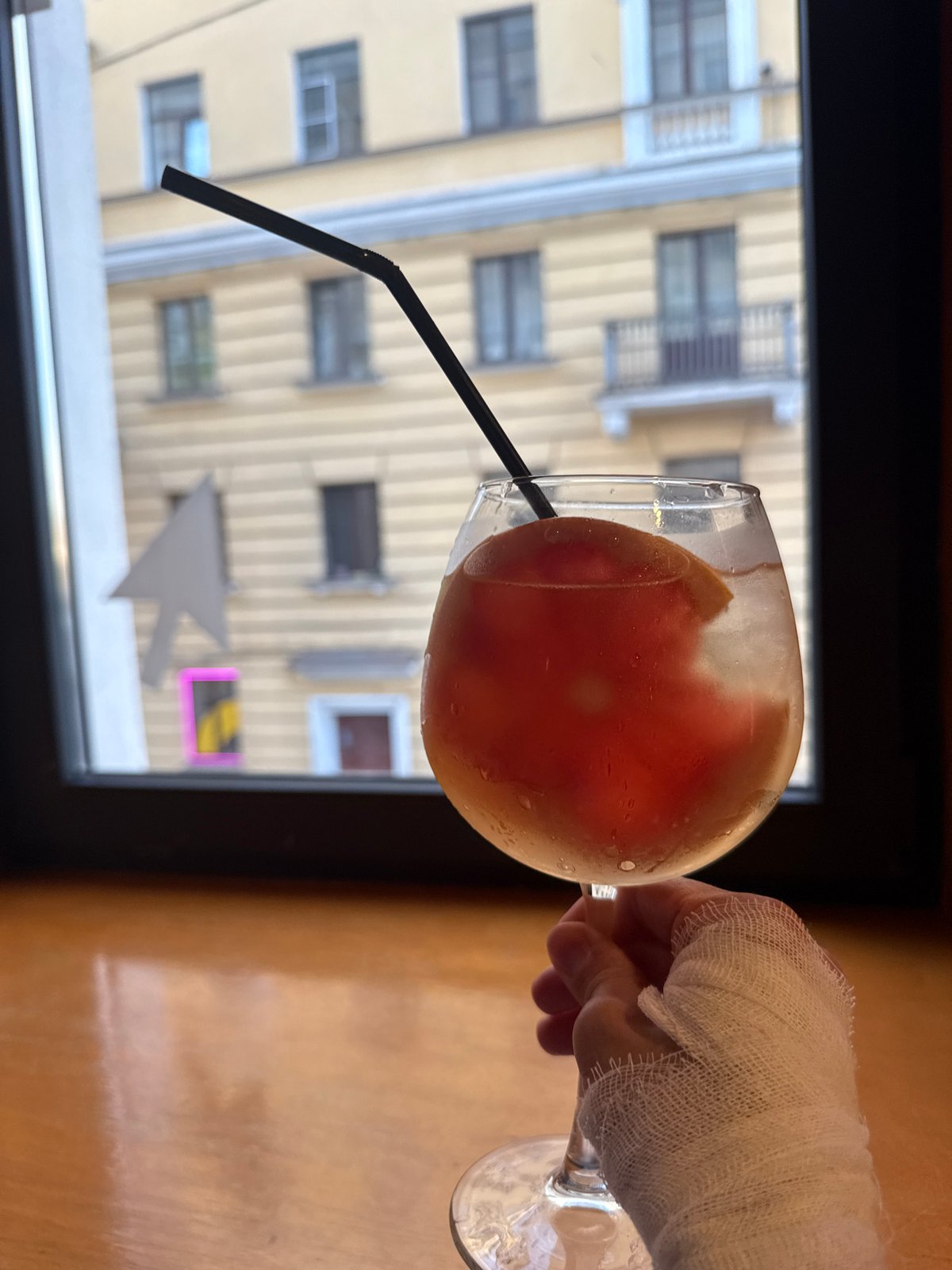 Woman celebrates with cake and cocktails at Saint Petersburg restaurant