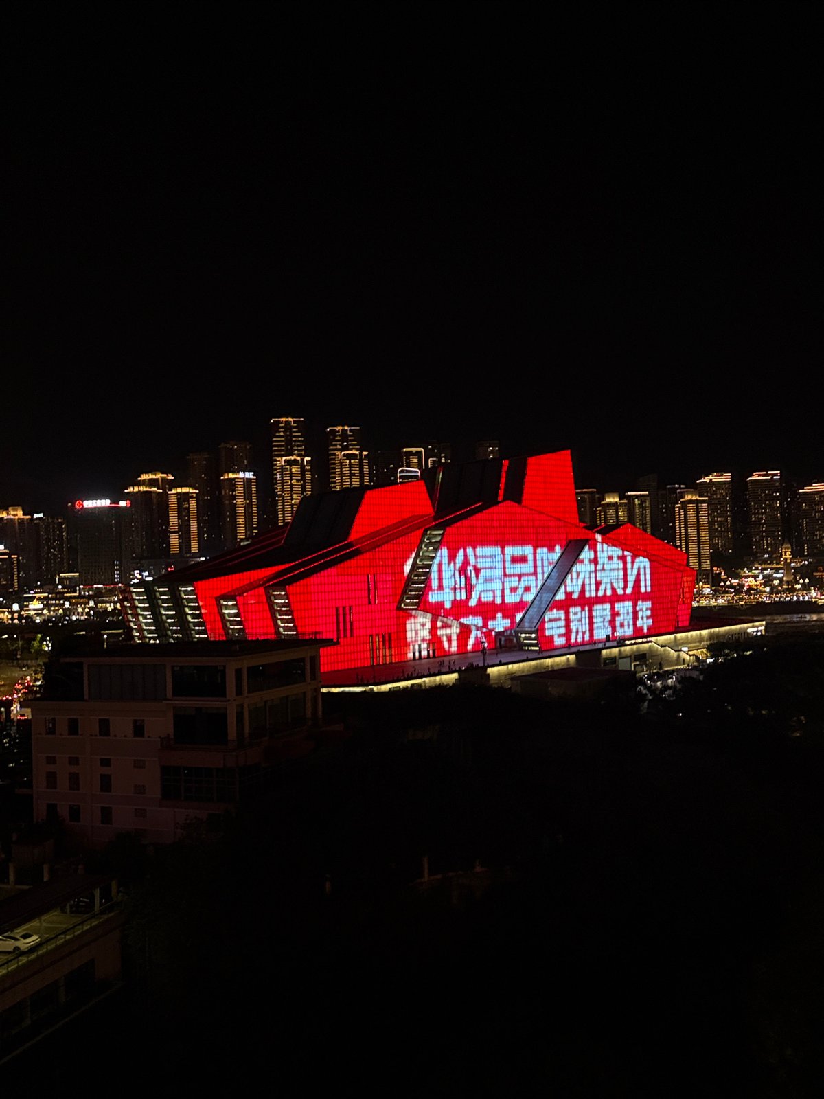 Chongqing's Jiangbeicheng waterfront glows on a summer night