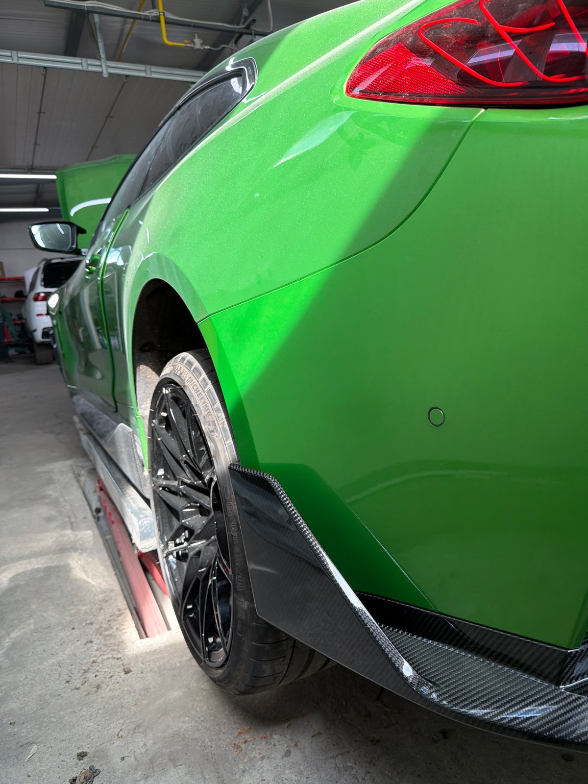 Collision-damaged green car undergoes major repairs in Burgas shop