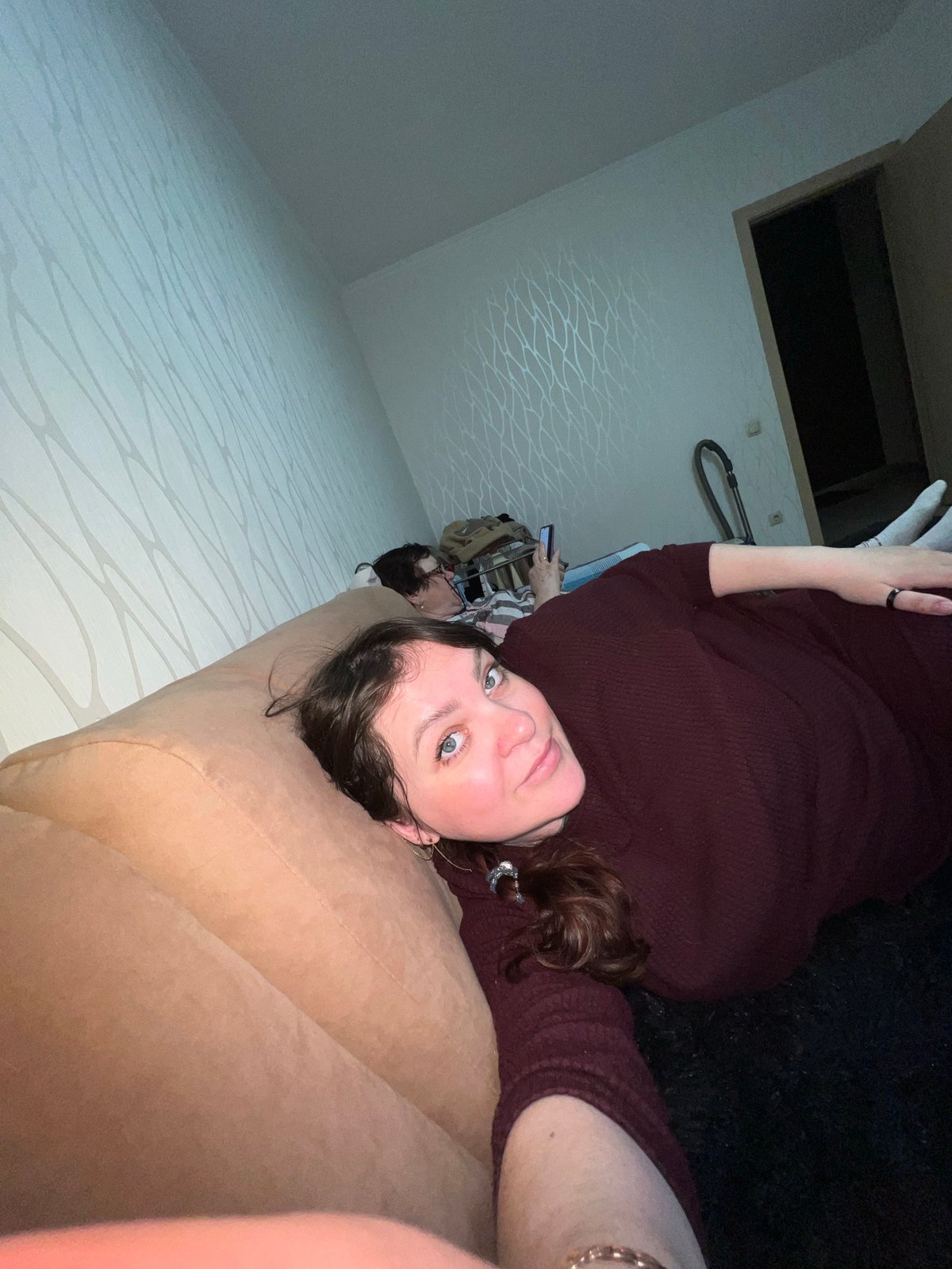 Women photograph casual indoor moments in Perm home