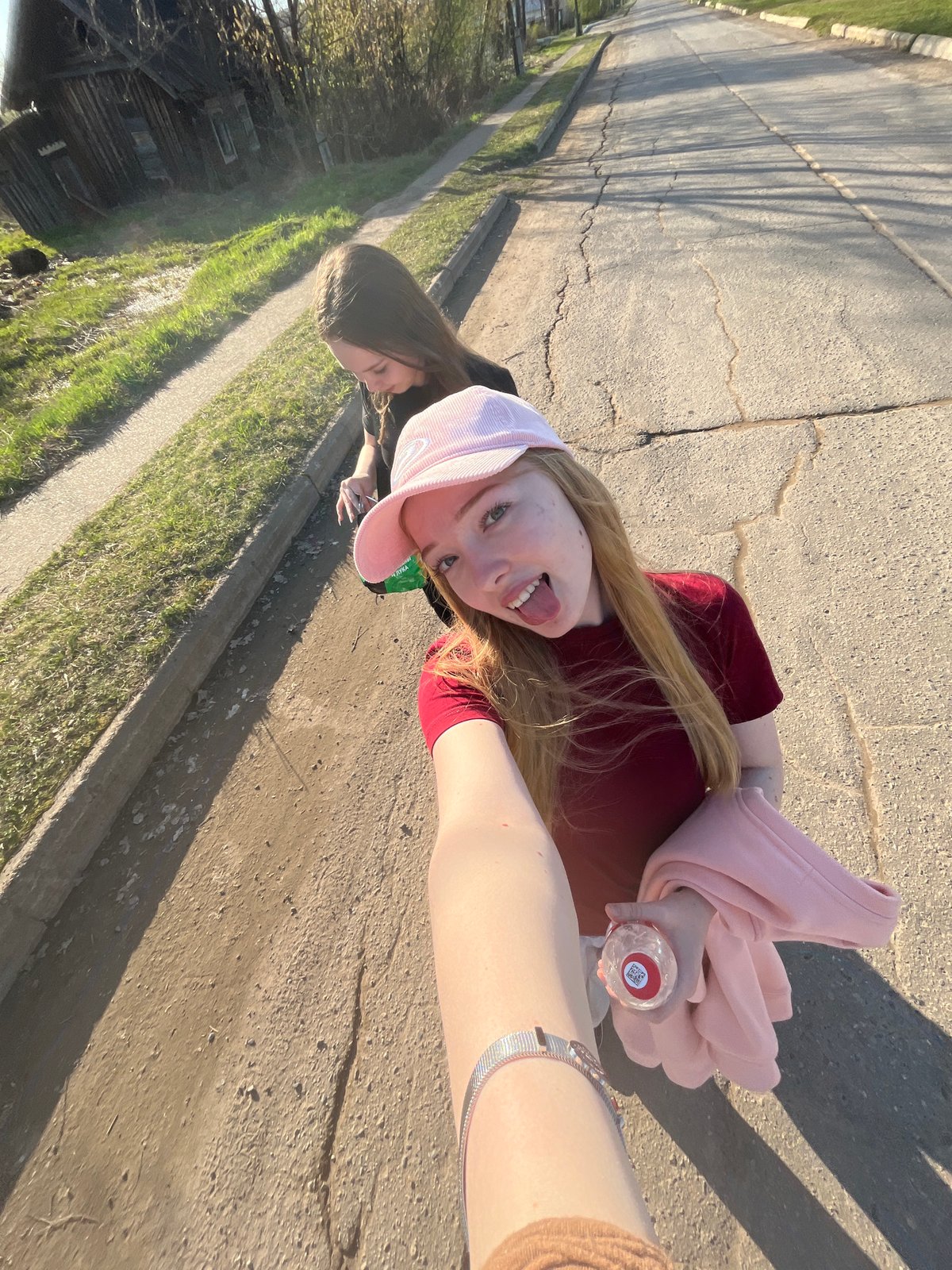 Two people meet on cracked road in Сосново, Russia
