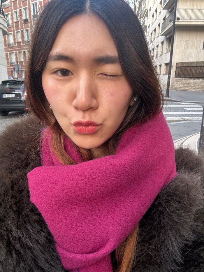 Woman Takes Selfies on Paris Street