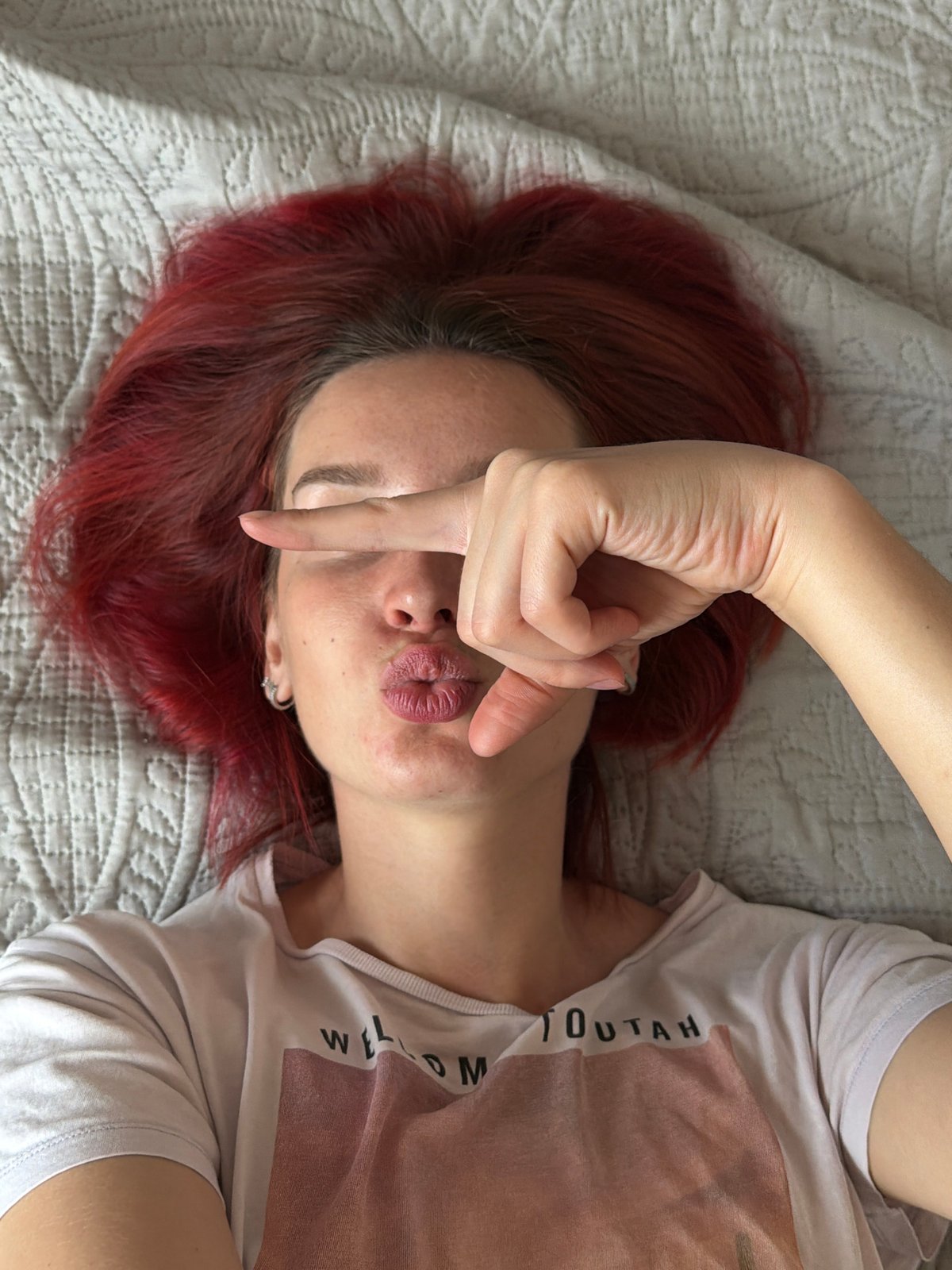 Woman takes morning selfies with cat in Chaikovsky home