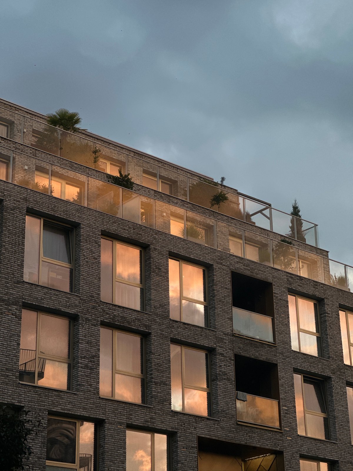 Sunset over Amsterdam apartments, yellow gifts in the foreground