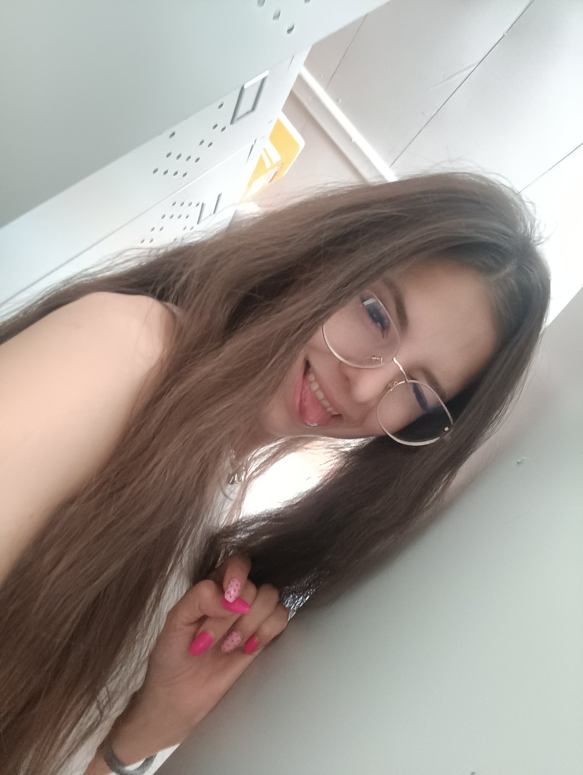 Woman poses playfully for photo in Прикамский, Russia