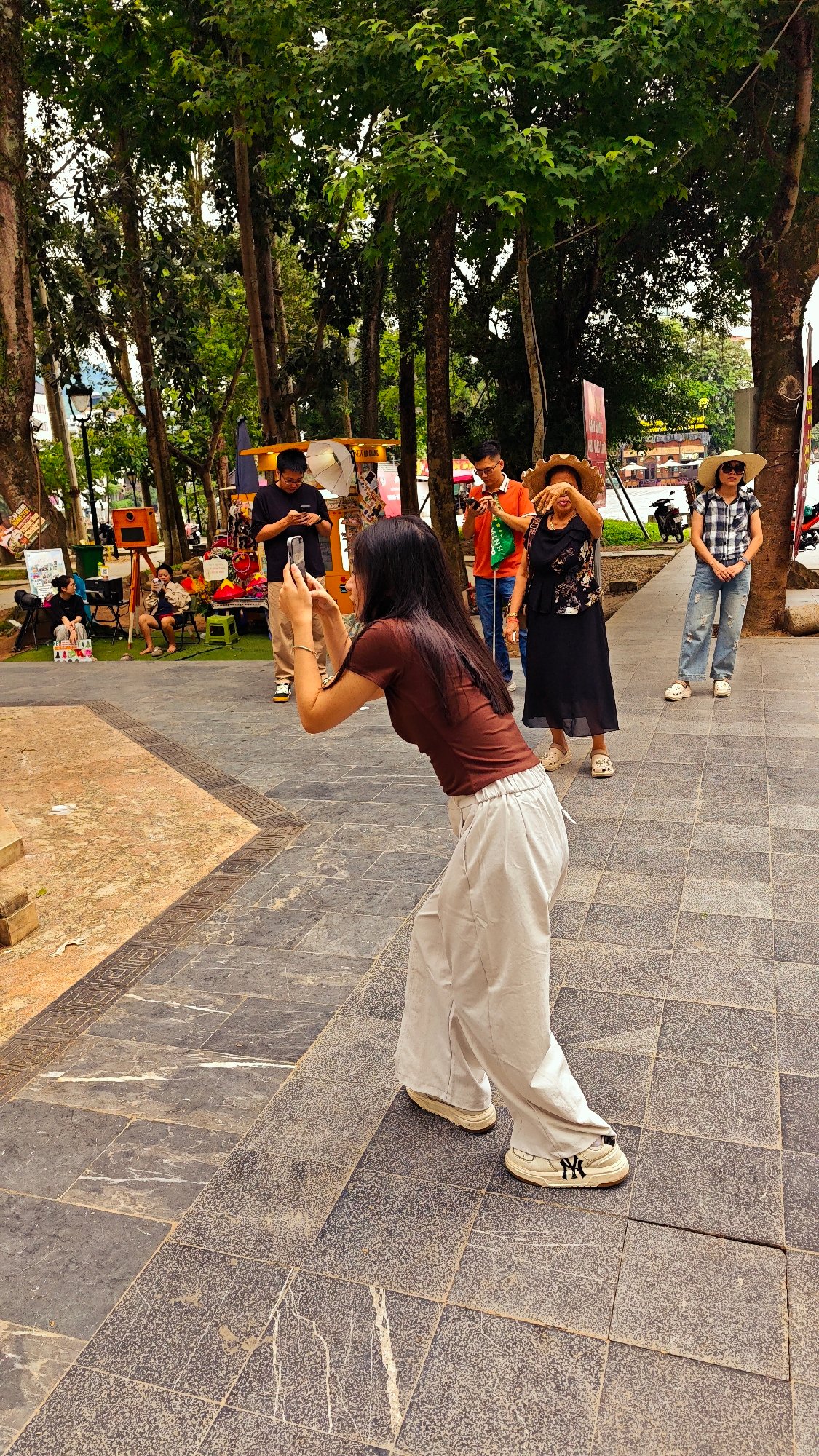 Early morning tourists photograph landmarks in Hà Giang Ward