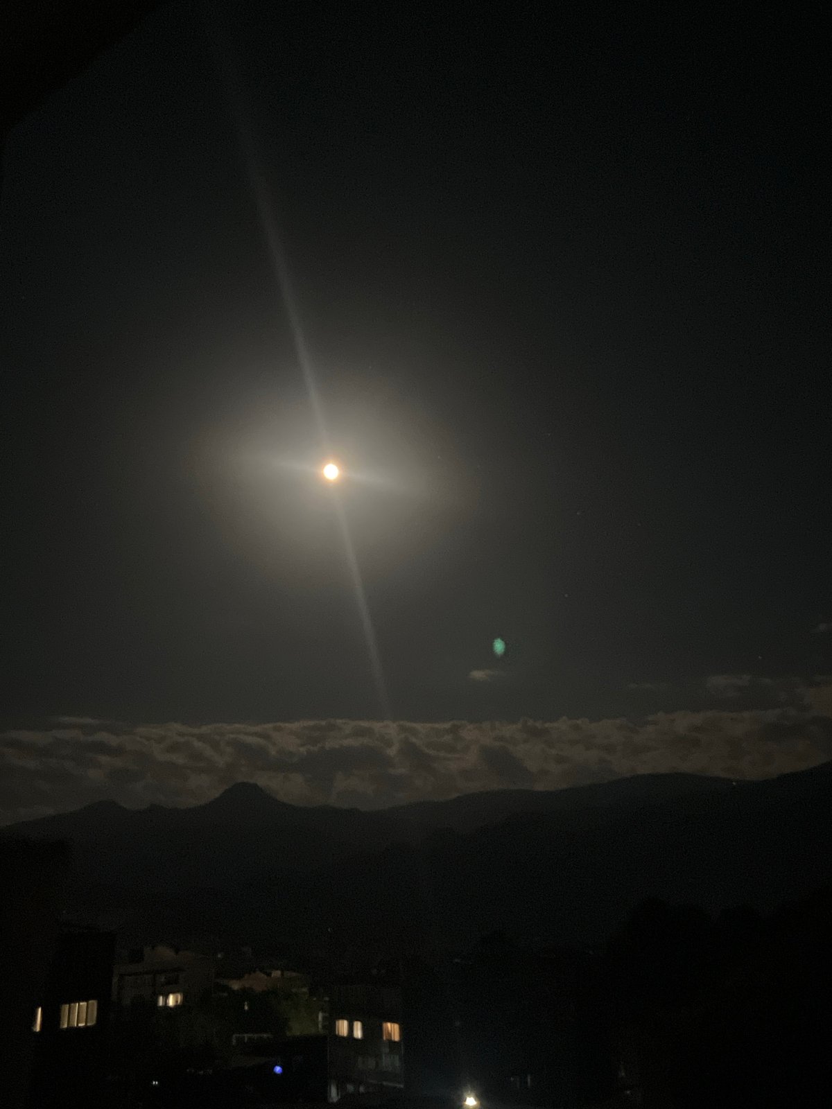 Full moon rises over a residential neighborhood in Gladzor, Armenia