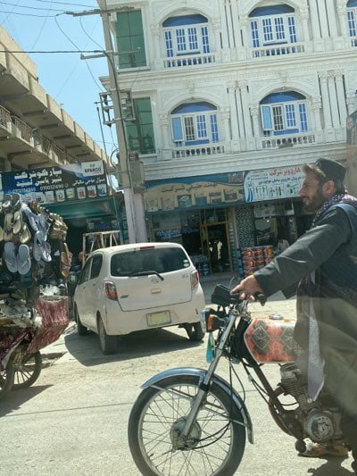 Morning sandal vendors draw customers on Kandahar street