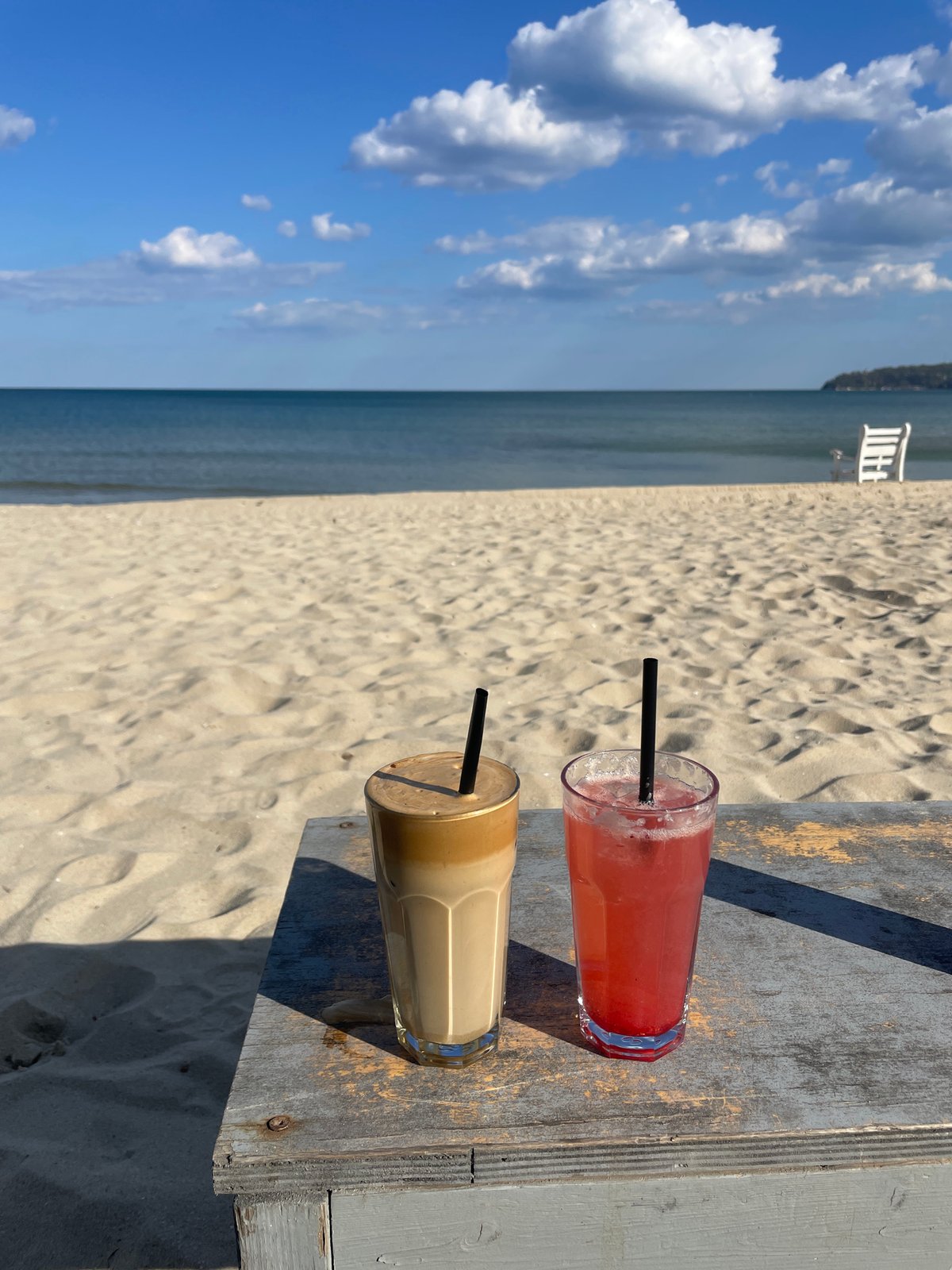 Beachside drinks captured on wooden table in Varna