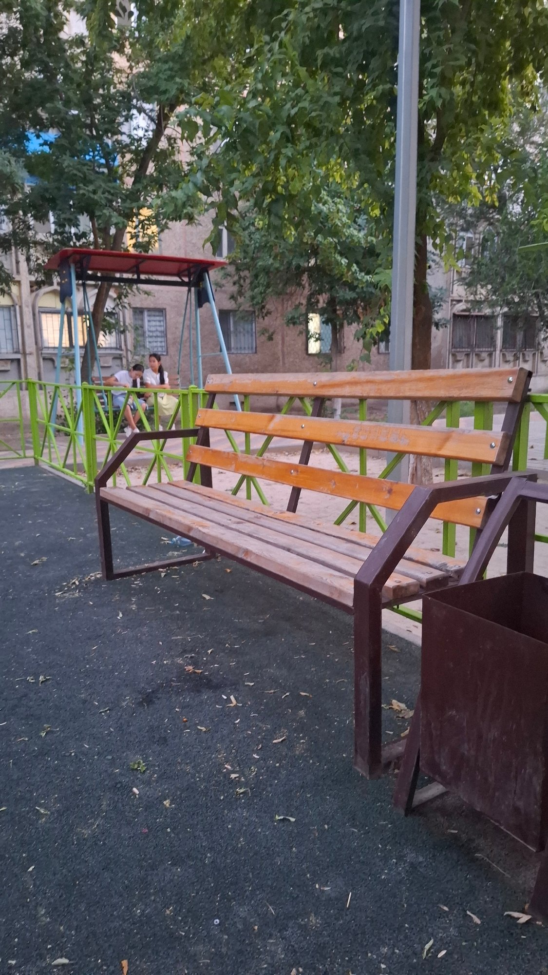 Shymkent residential playground and courtyard, summer afternoon
