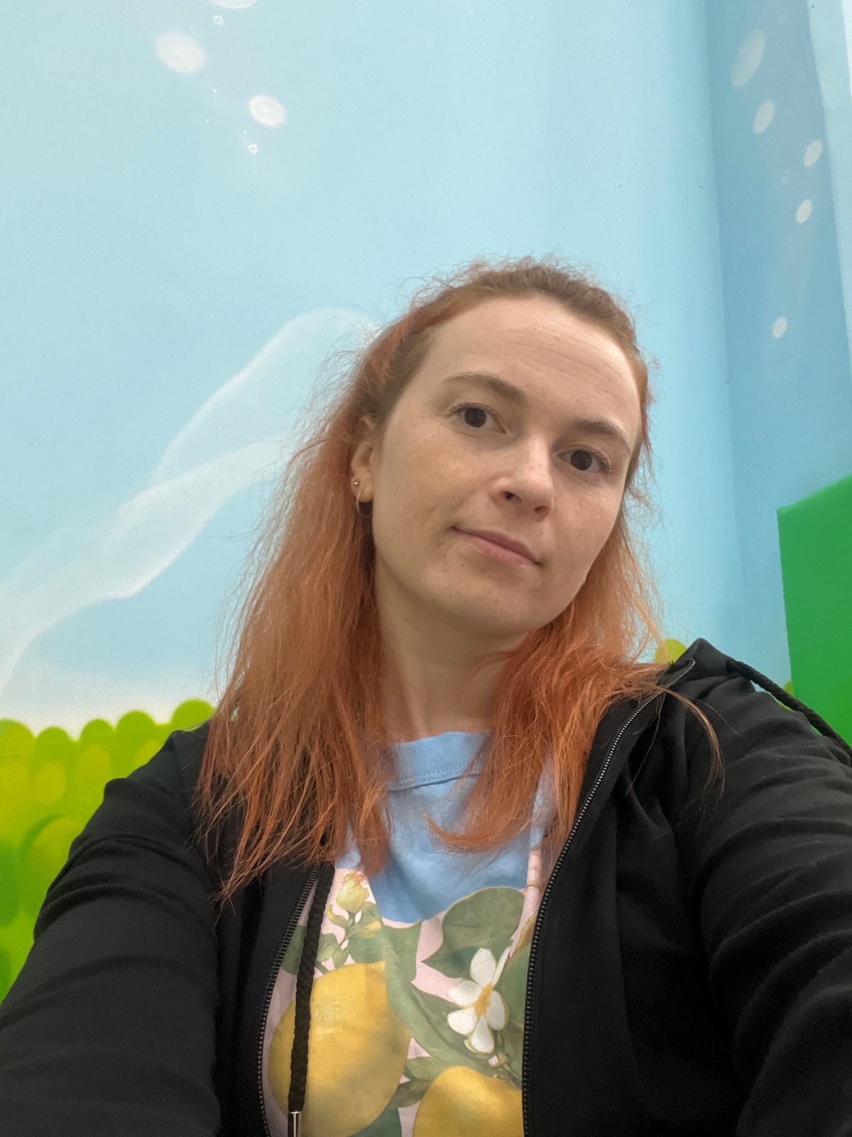 Inside a Moscow mall's children's play area, late July afternoon.