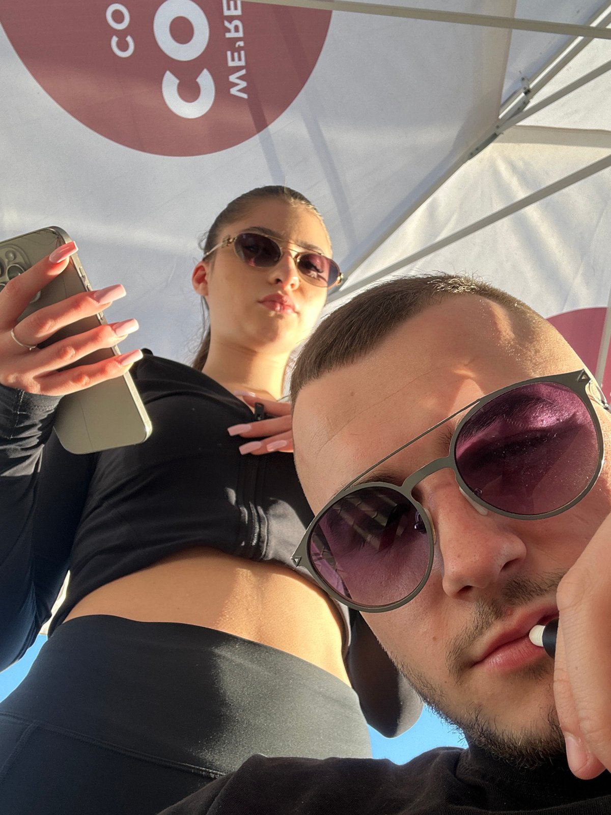 Two people take sunny day selfies in Plovdiv