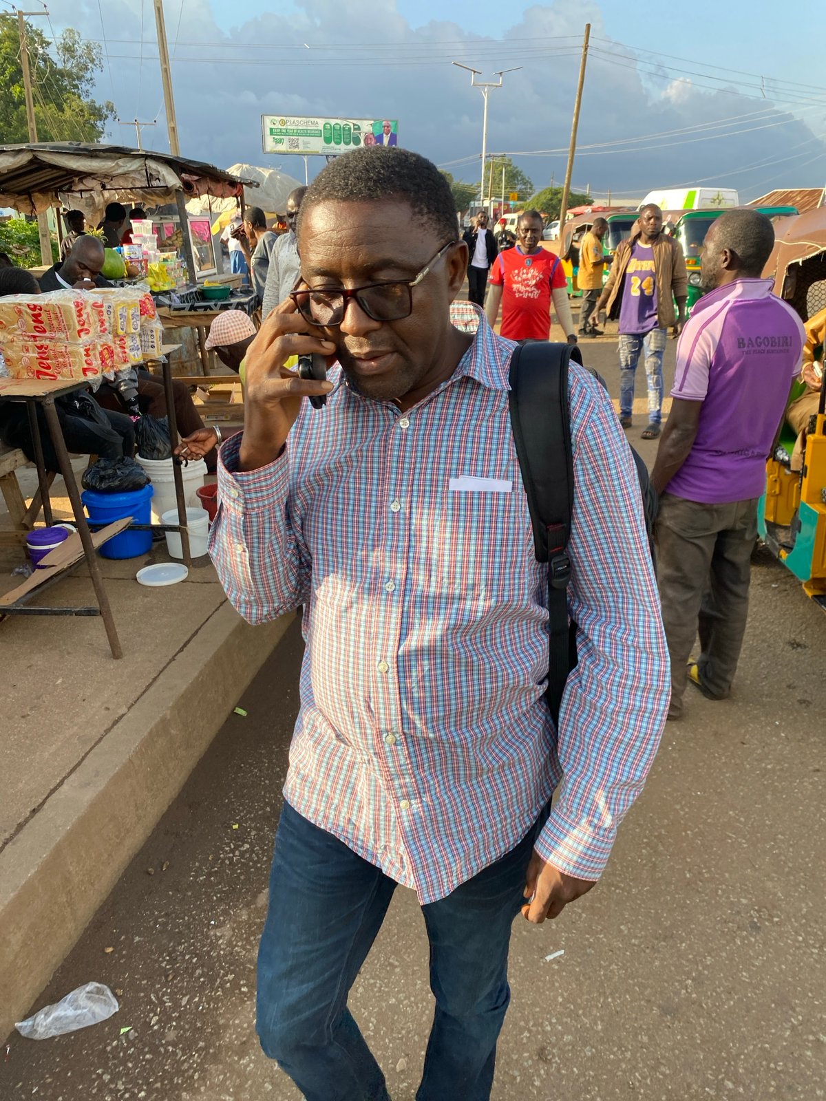 Everyday street life in Bukuru, Nigeria on a sunny afternoon