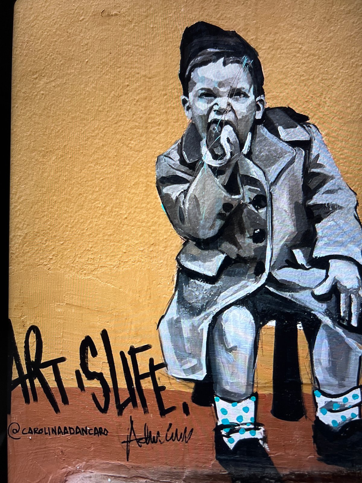 Child portrait painting displayed in Mollet Del Vallès