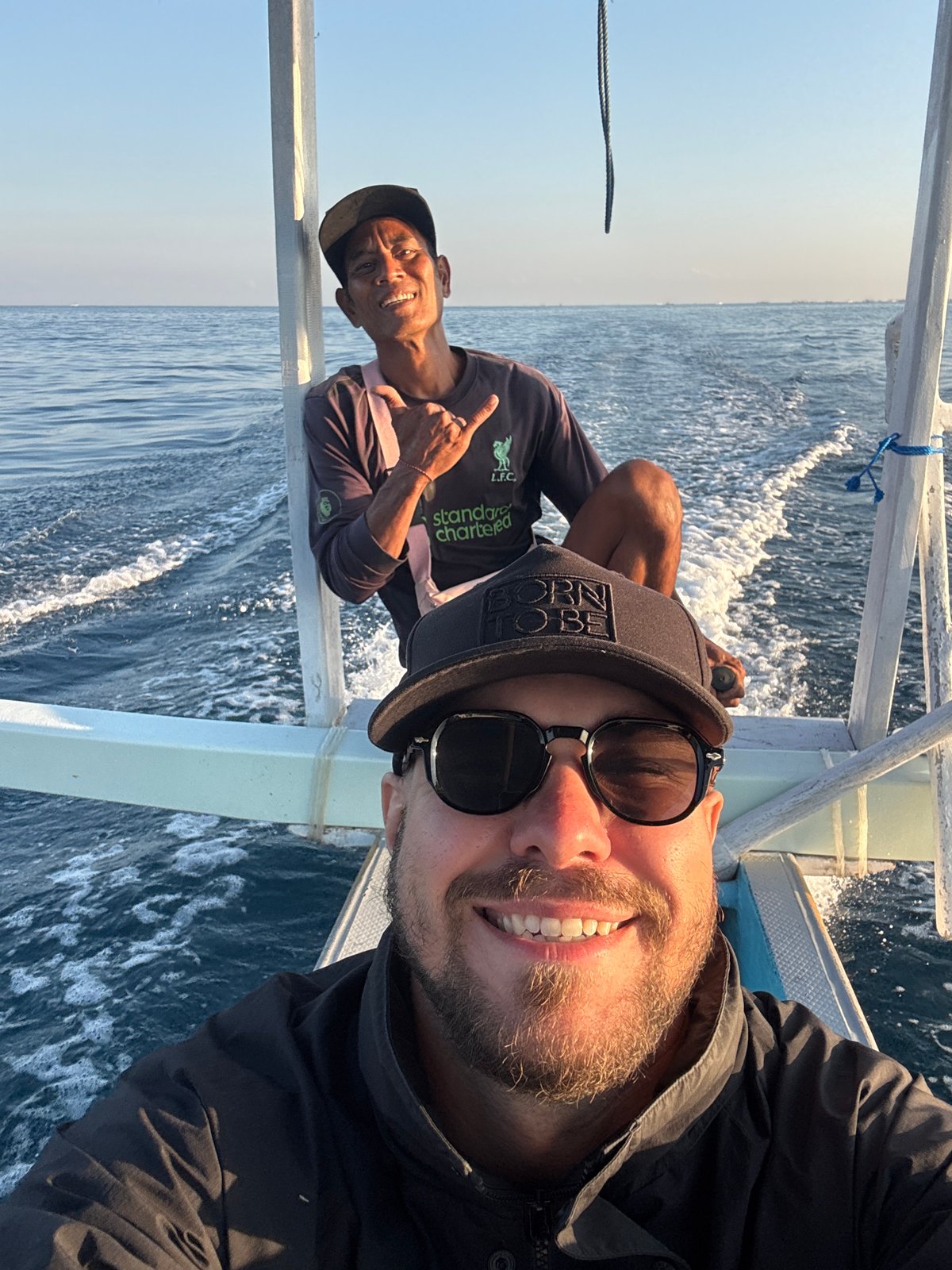 Outrigger boat ride along Buleleng's coast at sunset