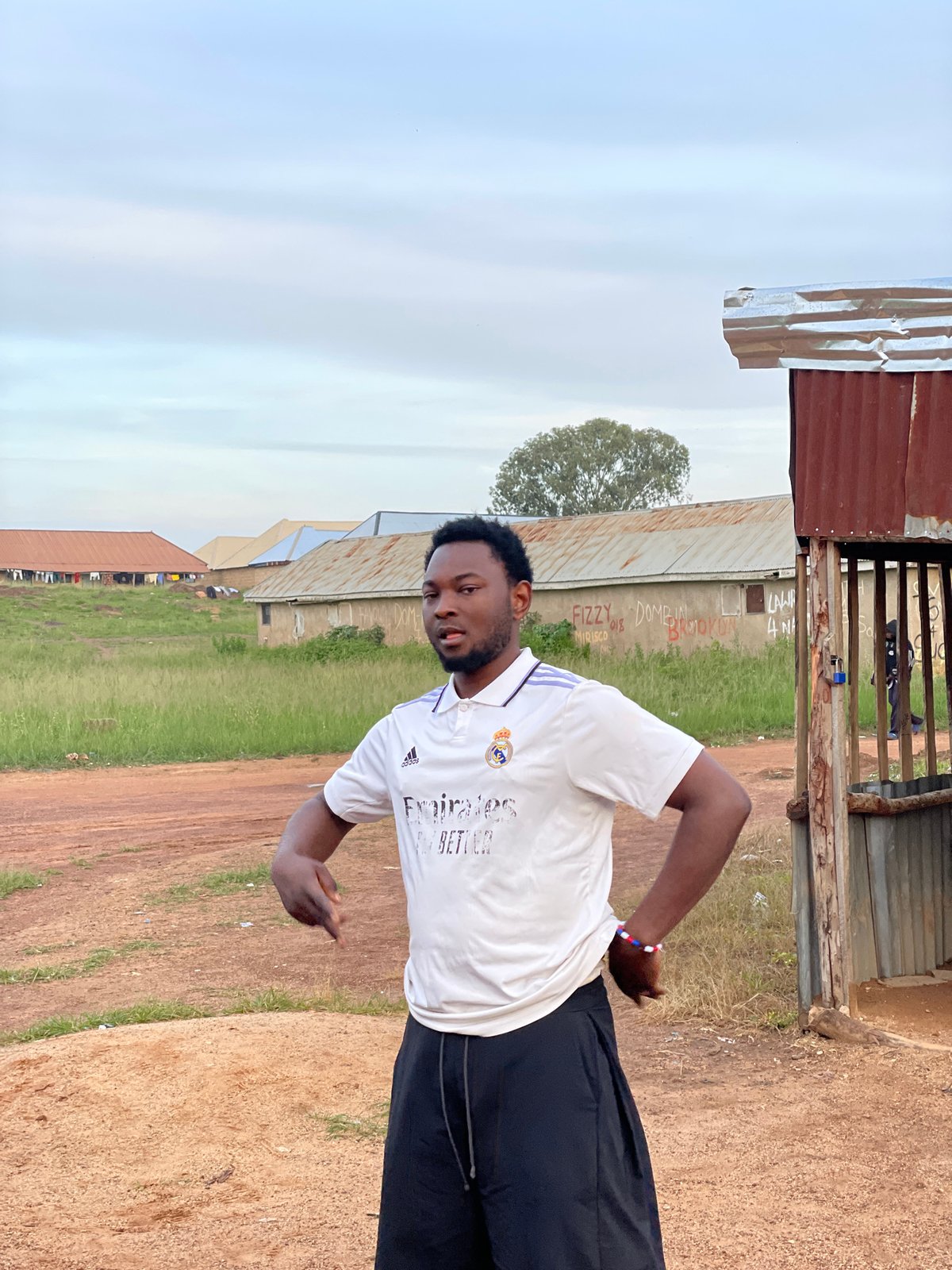 Outdoor barbershop and street life in Durumi, Nigeria
