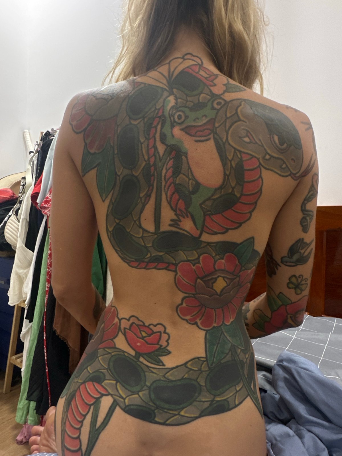 Tattooed individual photographed in private Mũi Né room