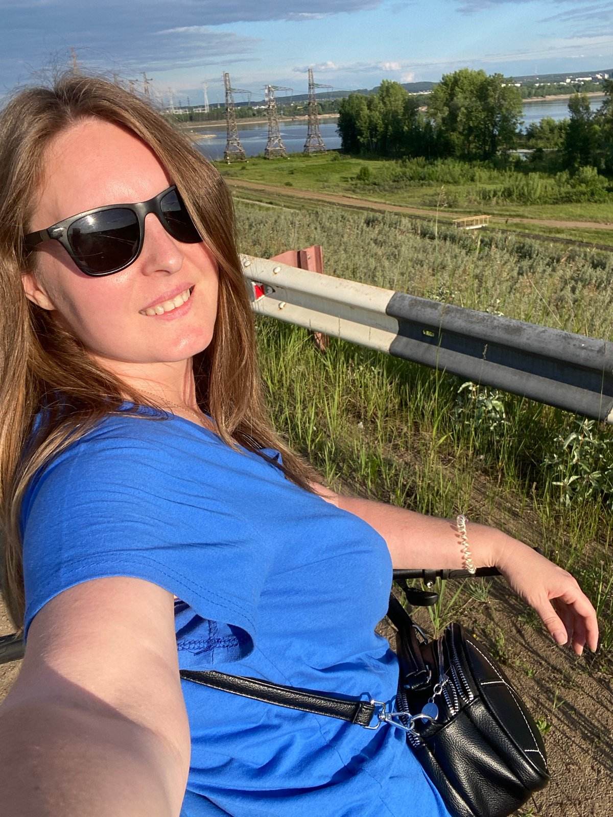 Woman documents afternoon visit to Chaikovsky industrial riverfront area