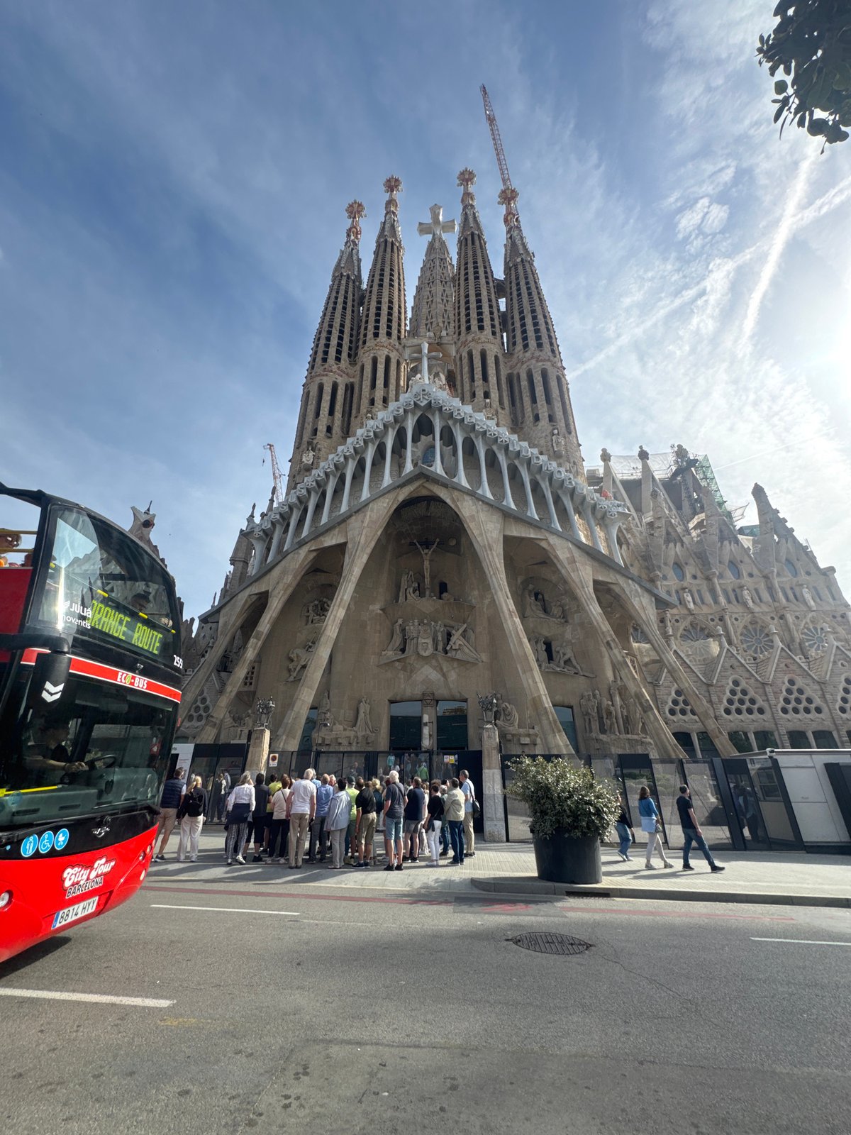 Tourist with walking stick visits Sagrada Familia in Barcelona