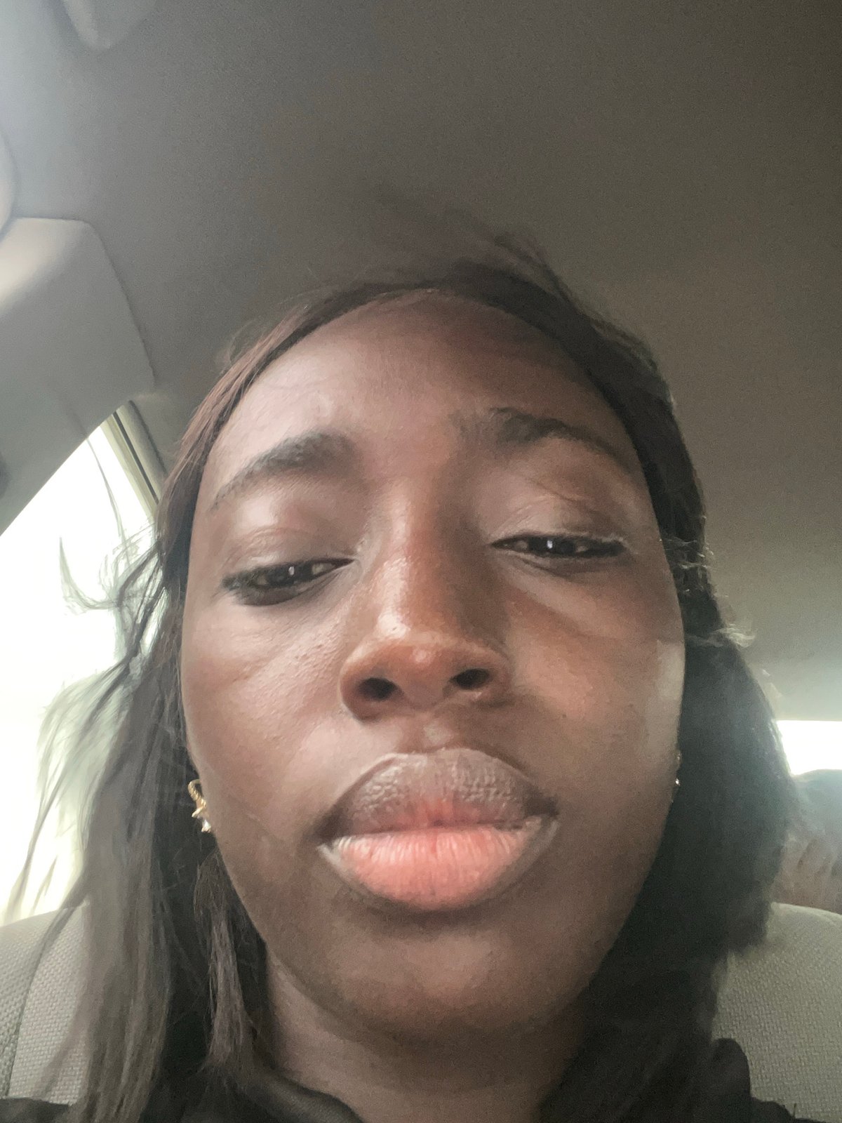 Woman photographed in vehicle in Karum, Nigeria