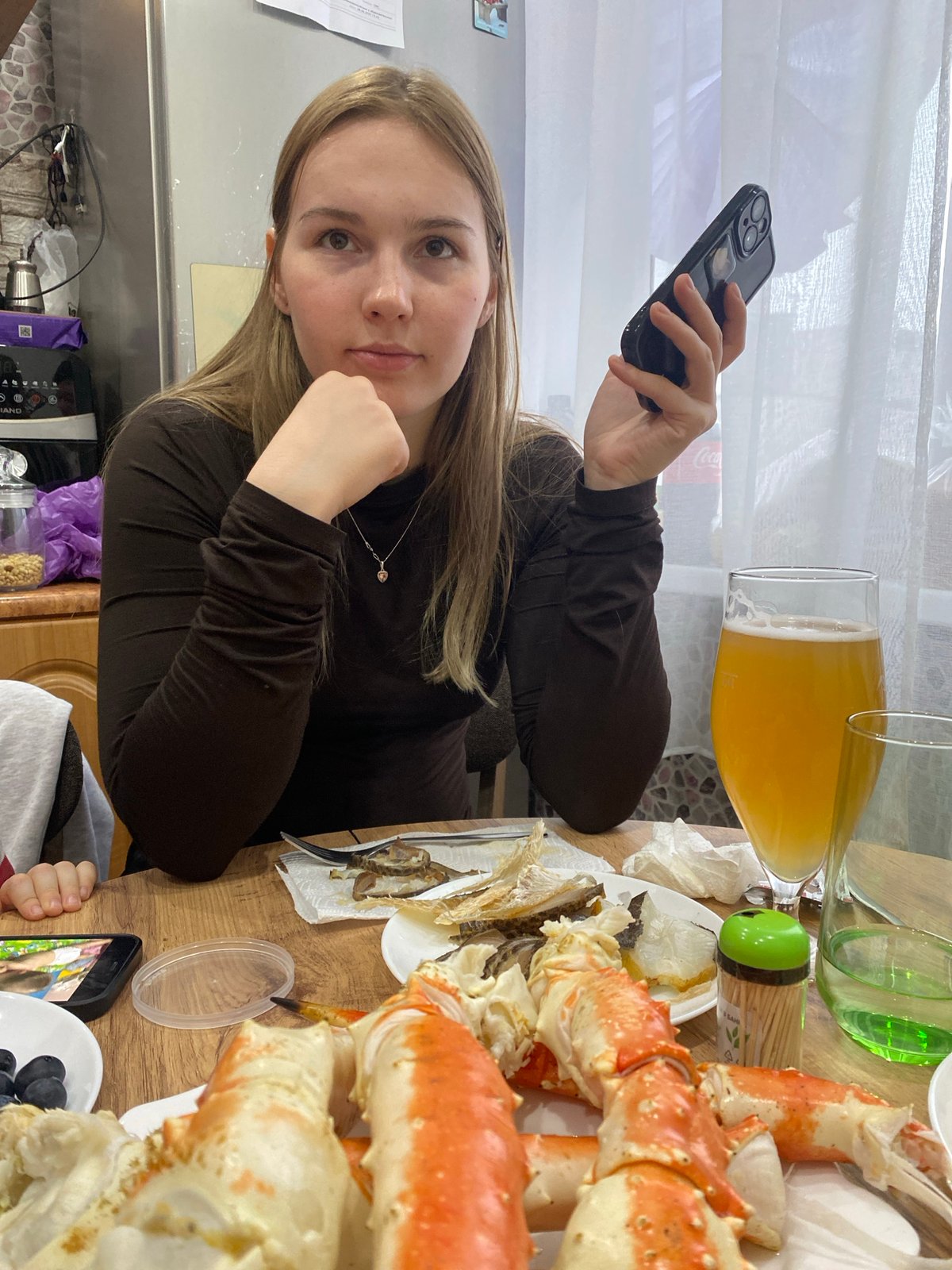 Woman shares quiet afternoon with cat in Murmansk home