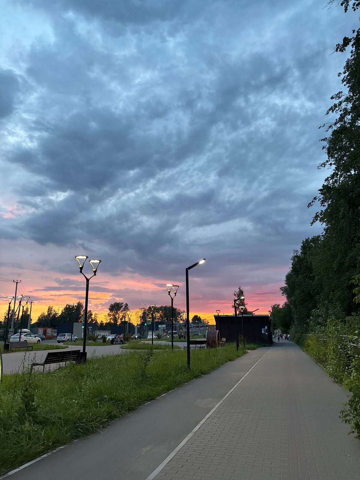 Sunset over a curved walkway as dusk settles in