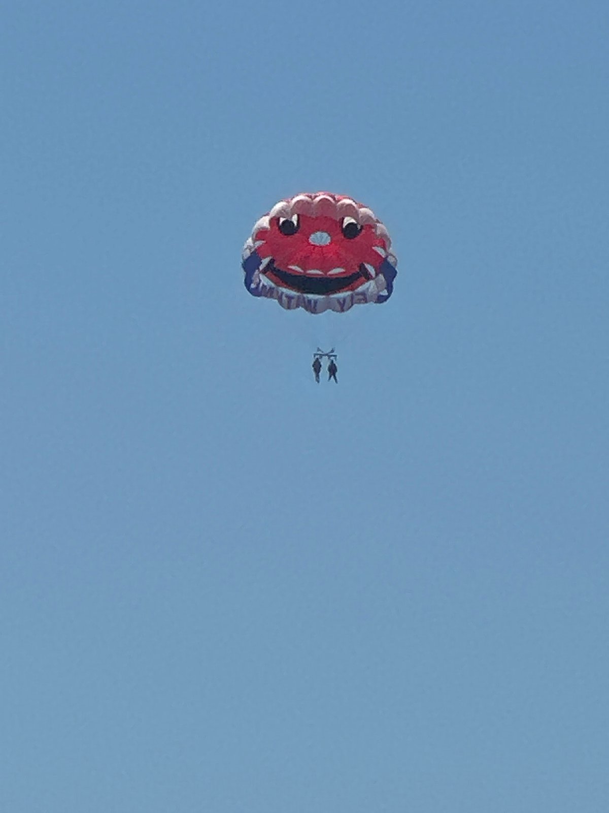 Summer day captured in Budva: parasailing, dining, balloons, beaches