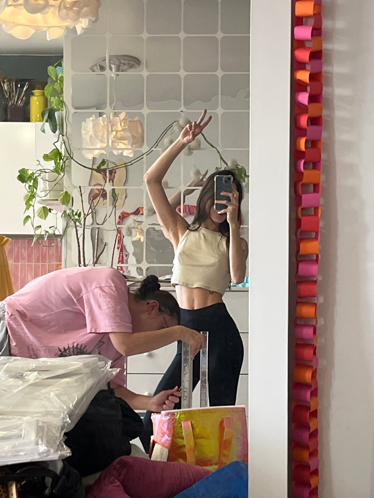 Women take mirror selfie in decorated room, Krasnoyarsk