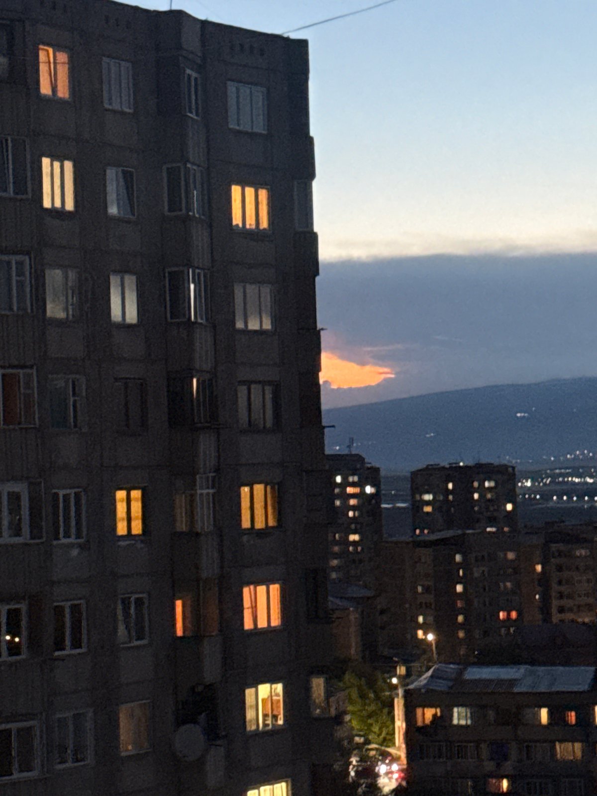 Twilight falls over Abovyan's apartment blocks and mountain backdrop