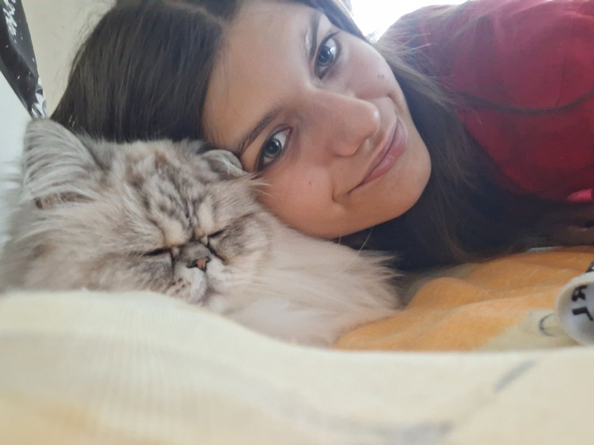 Woman takes selfies with cat in Panagyurishte bedroom