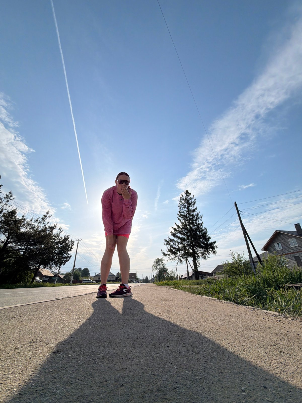 Person in pink outfit walks streets of Chaikovsky, Russia