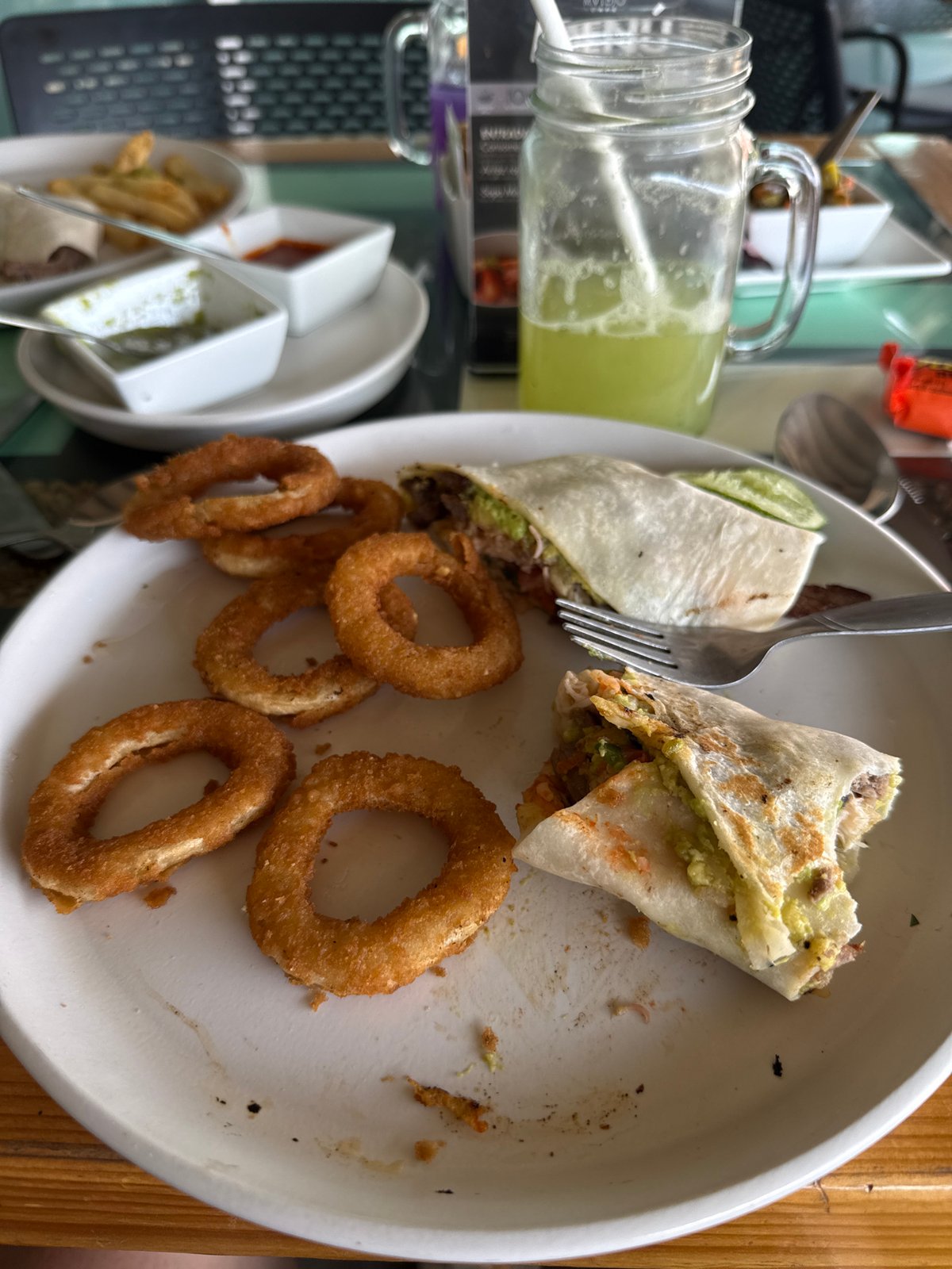 Dinner documented in Puebla featuring tortilla wraps and onion rings