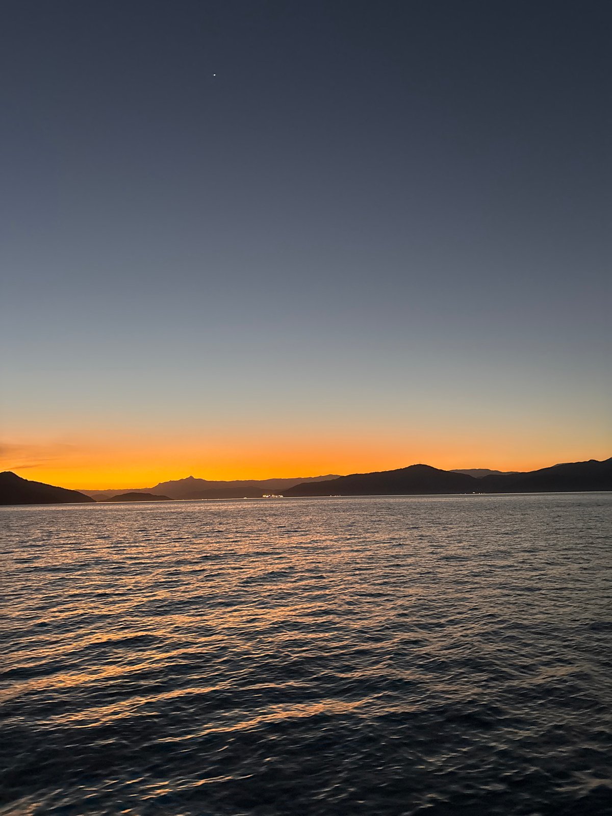 Sunset over Angra dos Reis bay, viewed from a ferry