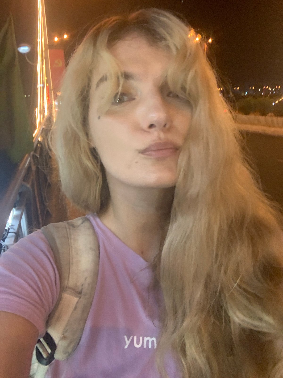 Nighttime selfie in Nha Trang with city backdrop