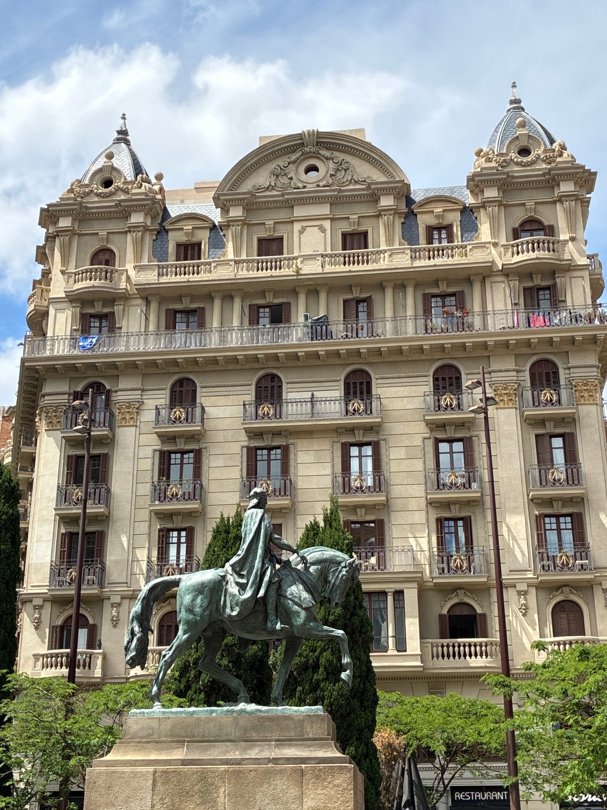 Tourist documents Barcelona landmarks during 10-minute city center walk