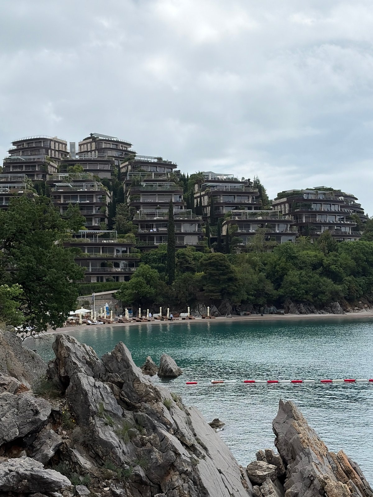 Modern green architecture and beach amenities observed in Budva