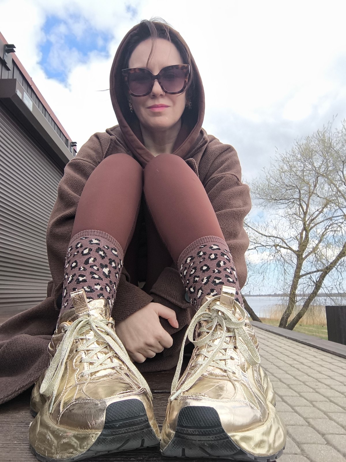 Woman in gold sneakers, leopard socks spotted in Riga